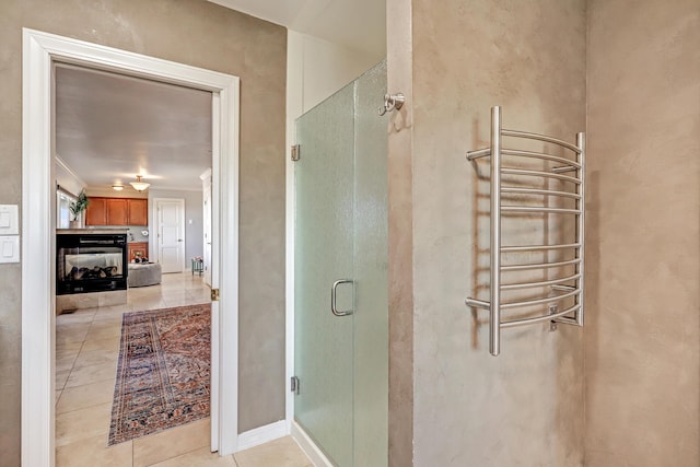 1106 Warm Sands Dr SE, Albuquerque, NM 87123 - bathroom featuring a towel warmer, a stall shower, tile patterned flooring, and radiator