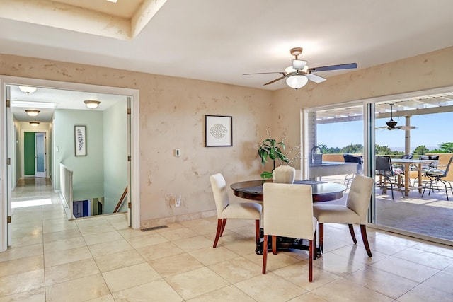 1106 Warm Sands Dr SE, Albuquerque, NM 87123 - dining room with a ceiling fan, light tile patterned floors, and baseboards