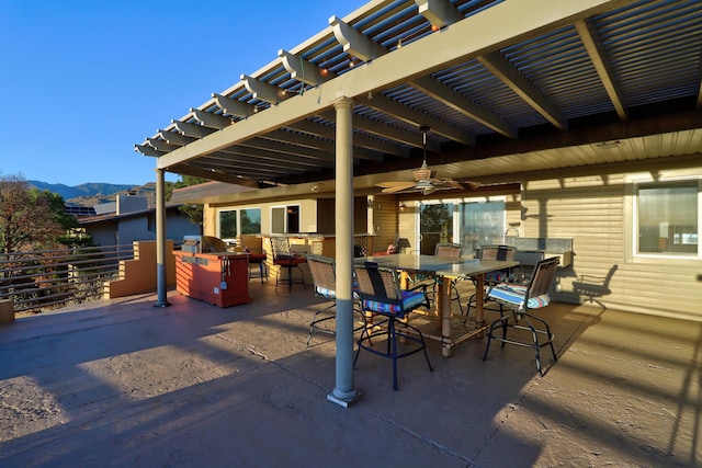 1106 Warm Sands Dr SE, Albuquerque, NM 87123 - view of patio featuring a pergola, a mountain view, and outdoor dining area