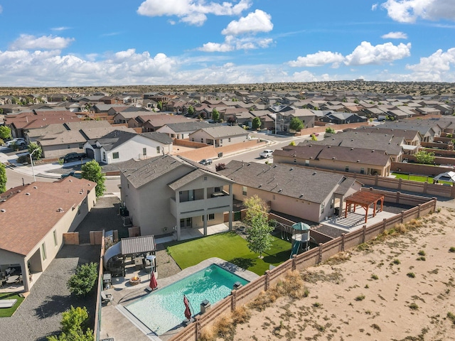aerial perspective of suburban area featuring a pool