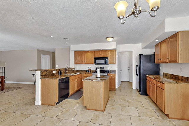 5727 Cibola Dr NE, Rio Rancho, NM 87144 - kitchen with black appliances, a kitchen island, dark stone counters, a peninsula, and light tile patterned floors