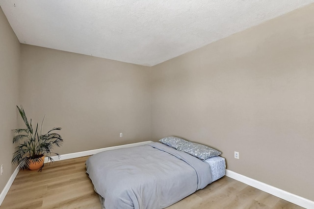 5727 Cibola Dr NE, Rio Rancho, NM 87144 - bedroom featuring wood finished floors