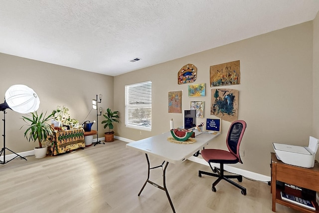 5727 Cibola Dr NE, Rio Rancho, NM 87144 - office with wood finished floors and a textured ceiling