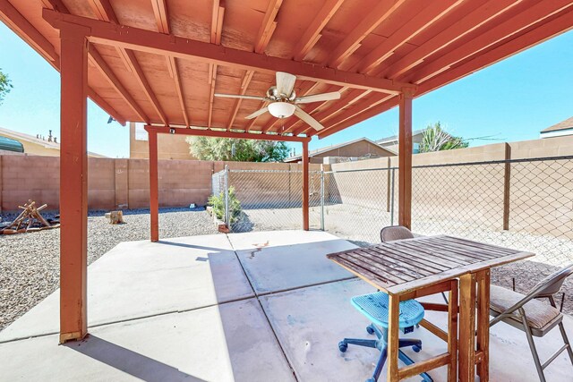 5727 Cibola Dr NE, Rio Rancho, NM 87144 - fenced backyard with a ceiling fan and a patio