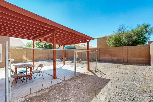 5727 Cibola Dr NE, Rio Rancho, NM 87144 - fenced backyard with a patio
