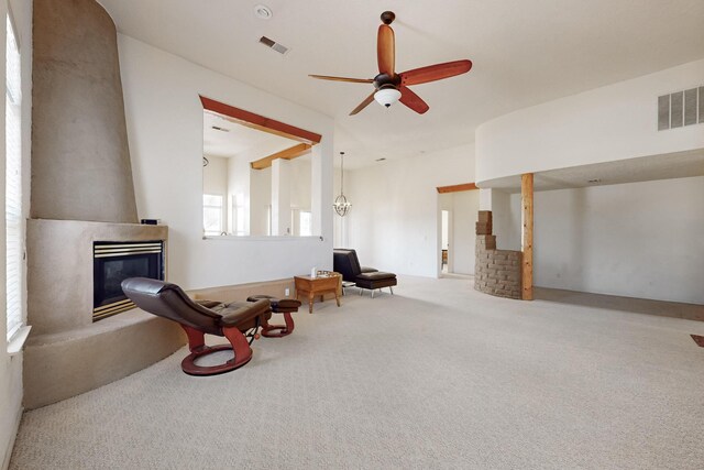 10216 Sand Sage Dr NW, Albuquerque, NM 87114 - sitting room with a glass covered fireplace, carpet, and ceiling fan
