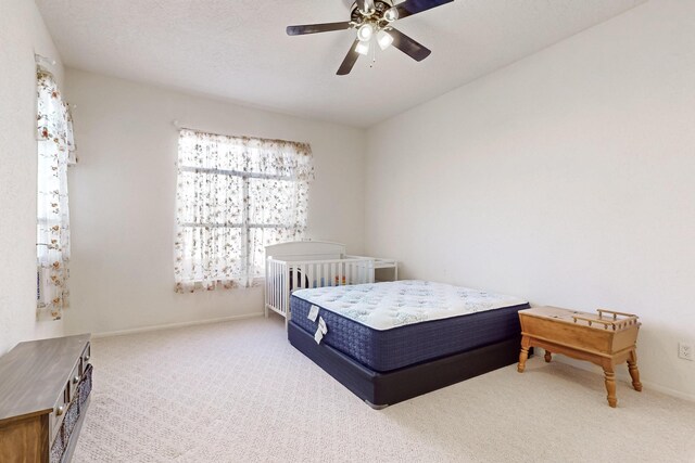 10216 Sand Sage Dr NW, Albuquerque, NM 87114 - bedroom with carpet, baseboards, and ceiling fan