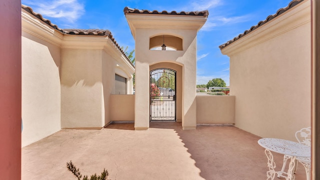 2815 Linda Pl SW, Albuquerque, NM 87105 - property entrance featuring a tile roof and stucco siding