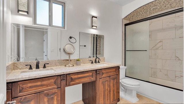 2815 Linda Pl SW, Albuquerque, NM 87105 - bathroom featuring toilet, enclosed tub / shower combo, and double vanity