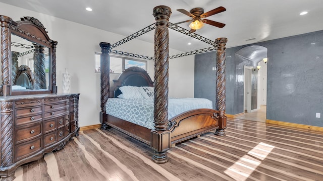 2815 Linda Pl SW, Albuquerque, NM 87105 - bedroom with arched walkways, wood finished floors, baseboards, recessed lighting, and a ceiling fan