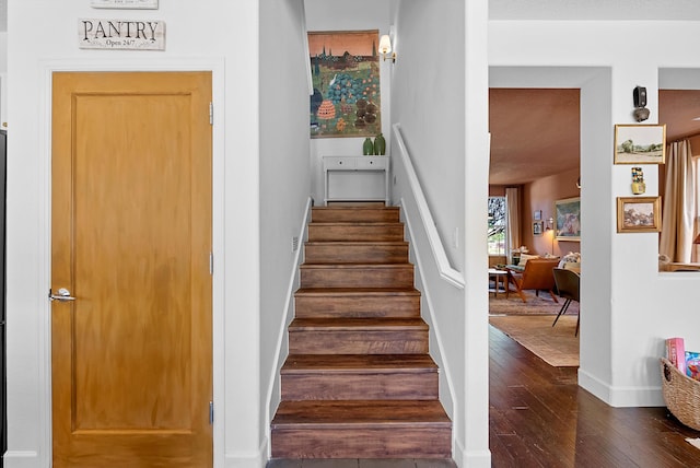 3515 Colina Serena Pl NE, Rio Rancho, NM 87124 - staircase featuring hardwood / wood-style flooring and baseboards