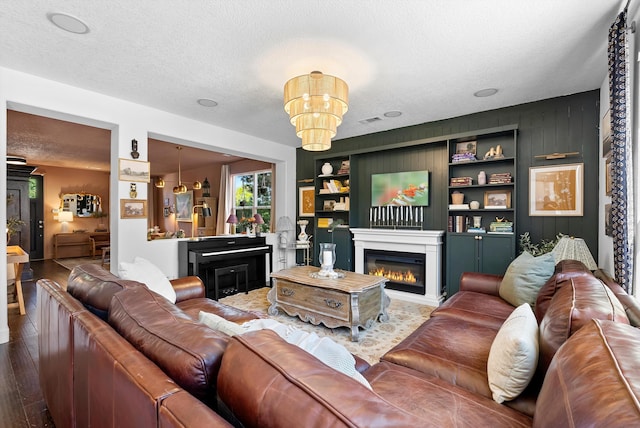3515 Colina Serena Pl NE, Rio Rancho, NM 87124 - living room with wood finished floors, a glass covered fireplace, a textured ceiling, and built in shelves