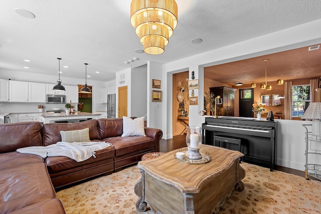 3515 Colina Serena Pl NE, Rio Rancho, NM 87124 - living room featuring a textured ceiling, a chandelier, light wood-type flooring, recessed lighting, and baseboards
