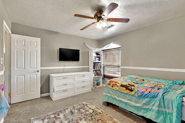 1905 Clearwater Loop NE, Rio Rancho, NM 87144 - bedroom with a textured ceiling, light carpet, and ceiling fan