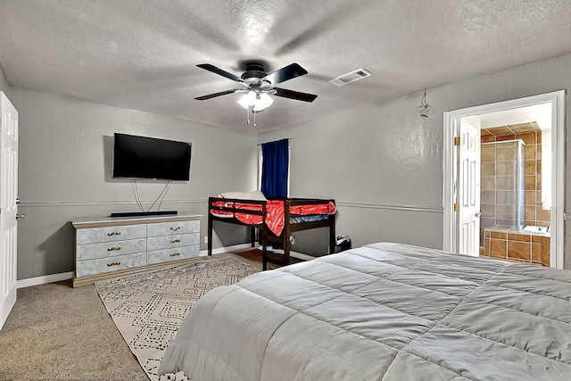 1905 Clearwater Loop NE, Rio Rancho, NM 87144 - carpeted bedroom featuring a textured ceiling, baseboards, ceiling fan, and ensuite bathroom