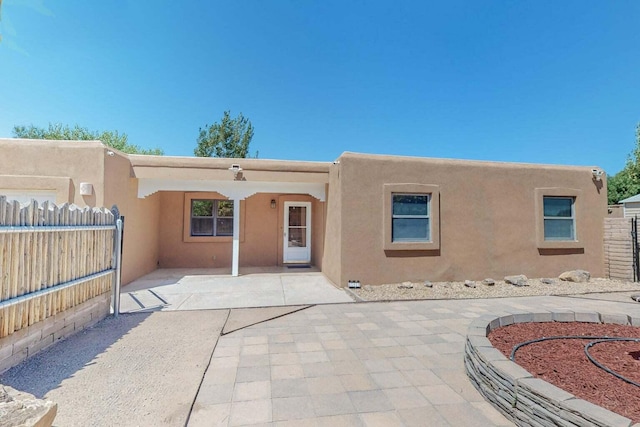 501 Calle De La Angel, Bernalillo, NM 87004 - back of house featuring stucco siding and a patio area