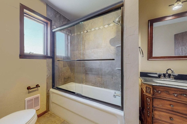 501 Calle De La Angel, Bernalillo, NM 87004 - bathroom with vanity, toilet, combined bath / shower with glass door, and tile patterned floors
