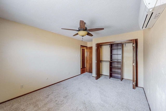 501 Calle De La Angel, Bernalillo, NM 87004 - unfurnished bedroom featuring a wall unit AC, light carpet, a closet, ceiling fan, and baseboards