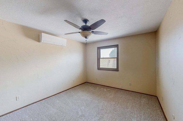 501 Calle De La Angel, Bernalillo, NM 87004 - empty room featuring a wall mounted AC, carpet, ceiling fan, a textured ceiling, and baseboards