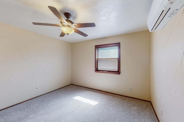 501 Calle De La Angel, Bernalillo, NM 87004 - unfurnished room featuring an AC wall unit, carpet flooring, a ceiling fan, a textured ceiling, and baseboards