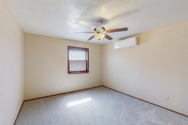 501 Calle De La Angel, Bernalillo, NM 87004 - carpeted empty room featuring a wall unit AC, a ceiling fan, a textured ceiling, and baseboards