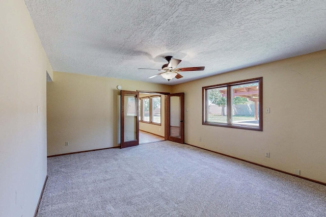 501 Calle De La Angel, Bernalillo, NM 87004 - spare room featuring a ceiling fan, carpet flooring, baseboards, and a textured ceiling