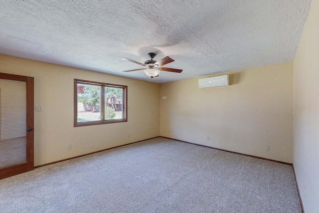501 Calle De La Angel, Bernalillo, NM 87004 - empty room with a wall mounted air conditioner, a ceiling fan, carpet, baseboards, and a textured ceiling