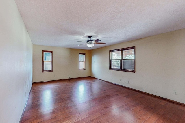 501 Calle De La Angel, Bernalillo, NM 87004 - empty room with wood finished floors, a textured ceiling, baseboards, and a ceiling fan