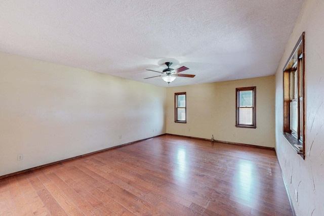 501 Calle De La Angel, Bernalillo, NM 87004 - unfurnished room featuring light wood-type flooring, ceiling fan, a textured ceiling, and baseboards