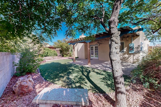 9737 Academy St NW, Albuquerque, NM 87114 - view of yard with french doors, ceiling fan, and a patio