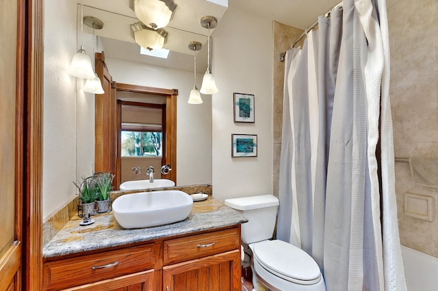 9737 Academy St NW, Albuquerque, NM 87114 - bathroom featuring vanity, toilet, and a shower with curtain