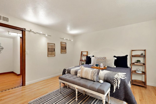 9737 Academy St NW, Albuquerque, NM 87114 - bedroom featuring light wood finished floors and baseboards