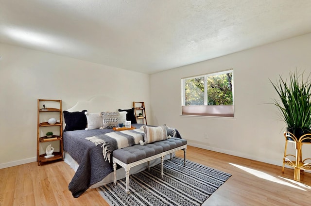 9737 Academy St NW, Albuquerque, NM 87114 - bedroom with light wood finished floors and baseboards