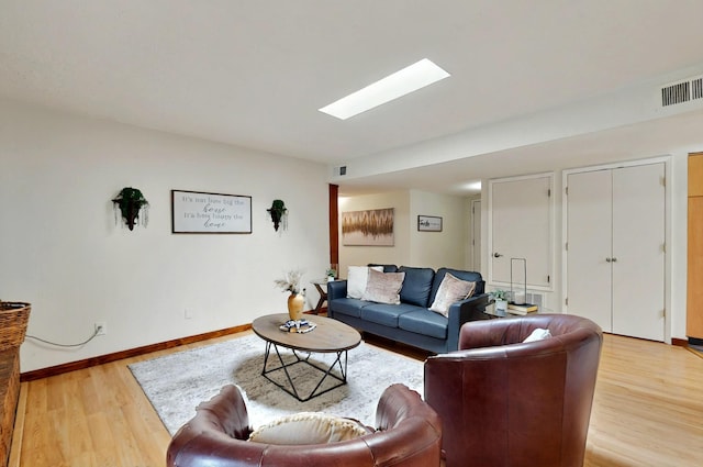9737 Academy St NW, Albuquerque, NM 87114 - living area with light wood-style flooring and baseboards