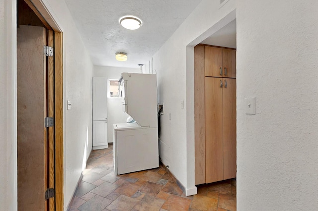 9737 Academy St NW, Albuquerque, NM 87114 - washroom featuring light stone finish flooring, a textured wall, and a textured ceiling