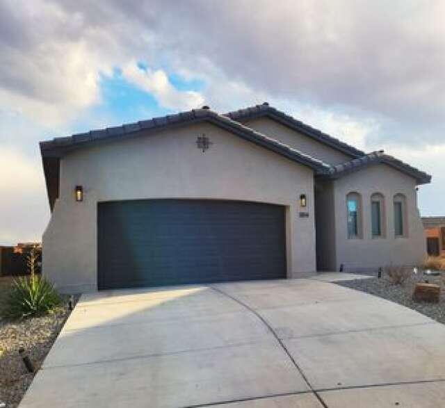 1814 Tesoro Loop NW, Los Lunas, NM 87031 - mediterranean / spanish house featuring a garage, stucco siding, concrete driveway, and a tile roof