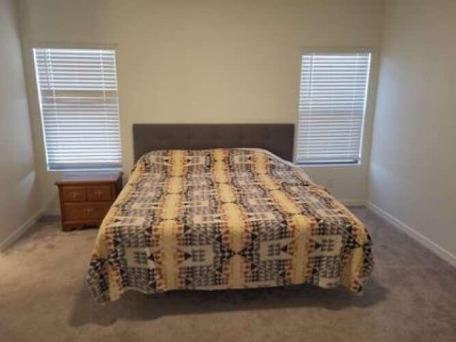 1814 Tesoro Loop NW, Los Lunas, NM 87031 - carpeted bedroom featuring baseboards