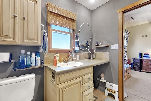 26 Apache Creek Rd, Santa Fe, NM 87505 - bathroom with vanity and tasteful backsplash