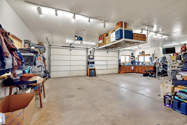 26 Apache Creek Rd, Santa Fe, NM 87505 - garage with a garage door opener