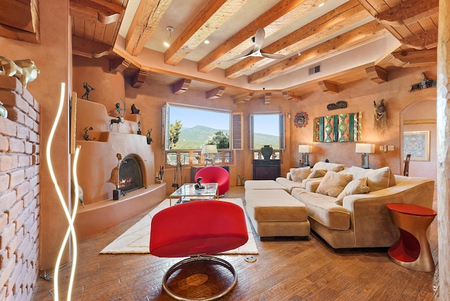 28 Canon Escondido, Sandia Park, NM 87047 - living room with wood-type flooring, beam ceiling, and a mountain view