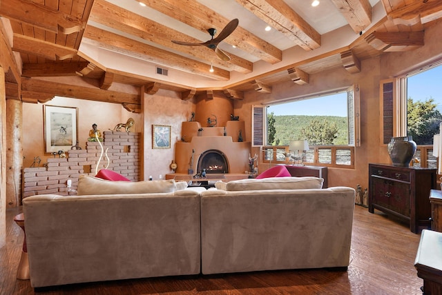 28 Canon Escondido, Sandia Park, NM 87047 - living area featuring beam ceiling, a ceiling fan, hardwood / wood-style flooring, a lit fireplace, and recessed lighting