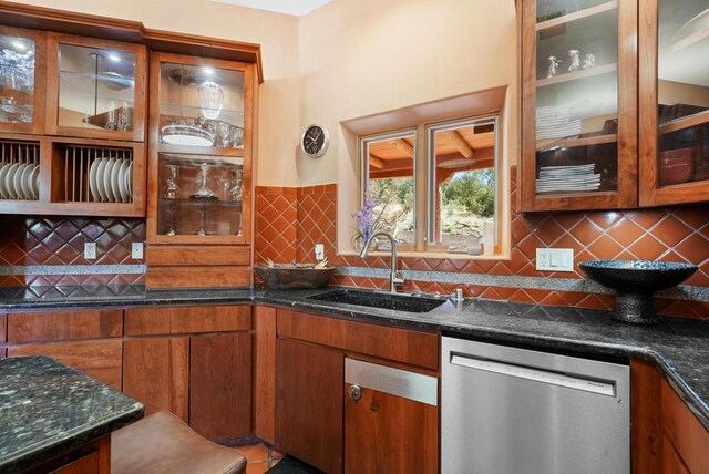 28 Canon Escondido, Sandia Park, NM 87047 - kitchen featuring dishwasher, a sink, backsplash, dark stone counters, and glass insert cabinets