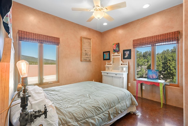 28 Canon Escondido, Sandia Park, NM 87047 - bedroom with concrete flooring and ceiling fan