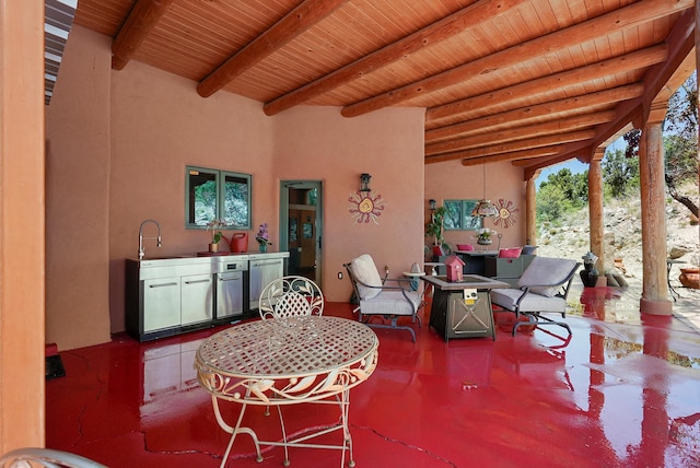 28 Canon Escondido, Sandia Park, NM 87047 - view of patio / terrace with outdoor dining space and a sink