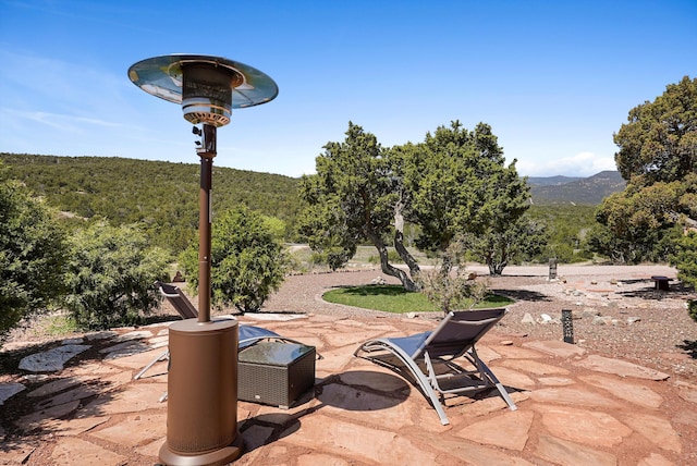 28 Canon Escondido, Sandia Park, NM 87047 - view of patio / terrace with a forest view and a mountain view