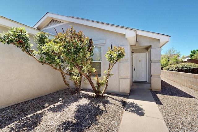 9927 Silverton Dr NW, Albuquerque, NM 87114 - view of exterior entry featuring stucco siding