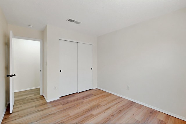9927 Silverton Dr NW, Albuquerque, NM 87114 - unfurnished bedroom featuring light wood-style floors and baseboards