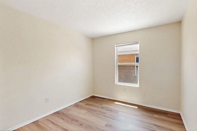 9927 Silverton Dr NW, Albuquerque, NM 87114 - spare room with wood finished floors and baseboards