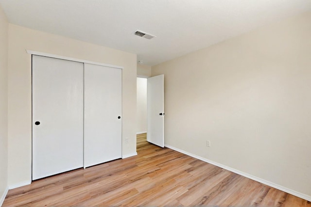 9927 Silverton Dr NW, Albuquerque, NM 87114 - unfurnished bedroom featuring light wood finished floors, a closet, and baseboards