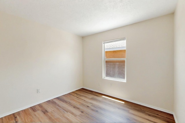 9927 Silverton Dr NW, Albuquerque, NM 87114 - unfurnished room with wood finished floors and baseboards